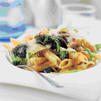 Warm Roasted Broccoli Salad with Pasta in a white plate