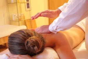 A woman getting a chiropractic spinal adjustment by a Chiropractor St Paul